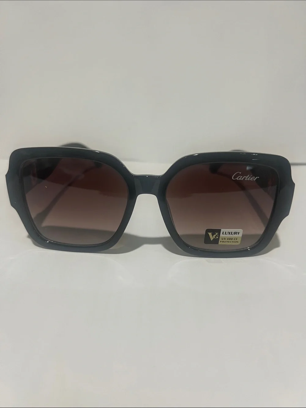 Cartier Women's Black Frame Sunglasses with Brown Gradient Lenses